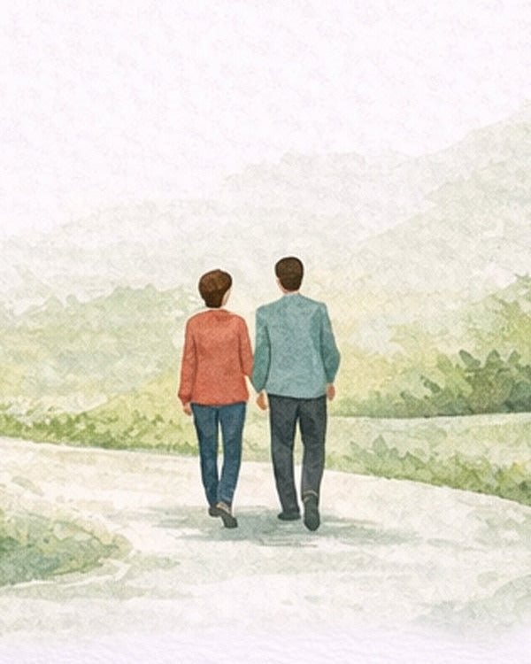 Two people walking away on a path with a scenic background